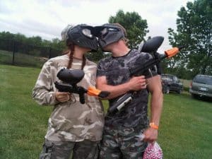 Kathy and Kirk Haan kissing after paintball