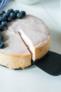 serving blueberry cheesecake