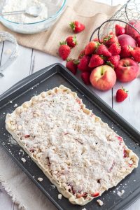 The crumbly mixture should cover the top of the fruit in The best white peach strawberry bars