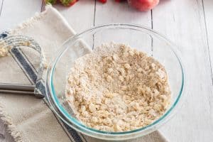 The crumbly mixture for The best white peach strawberry bars