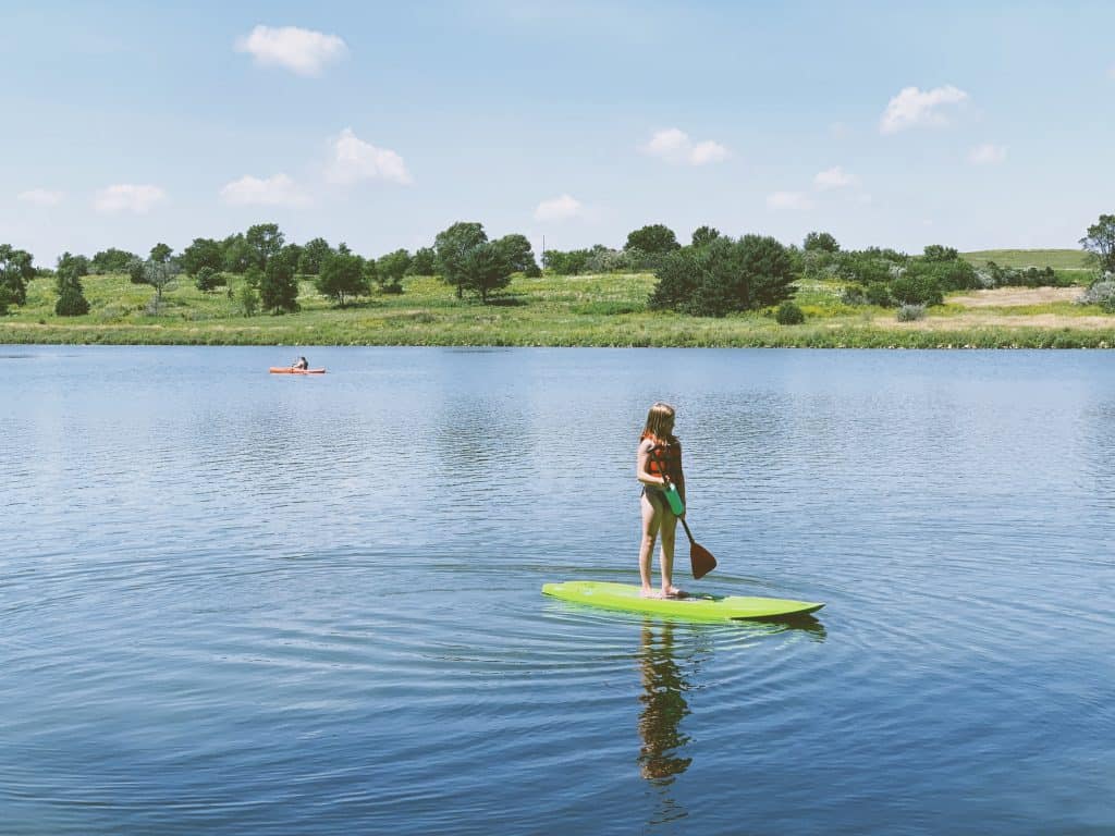 Stand up paddle boarding at Littlefield Recreational Area near Audubon, Iowa