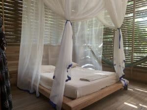 Photos of the Amazon: A bed with a mosquito net at a commune about 20 minutes outside of Leticia, Amazonas, Colombia—in the heart of the rainforest