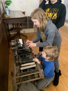 Playing with a typewriter at the Condon Bank in Coffeyville KS