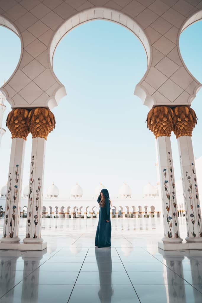 20 photos to inspire you to visit Abu Dhabi - sheikh zayed grand mosque with beautiful woman