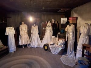 Old fashioned dresses in a dark room