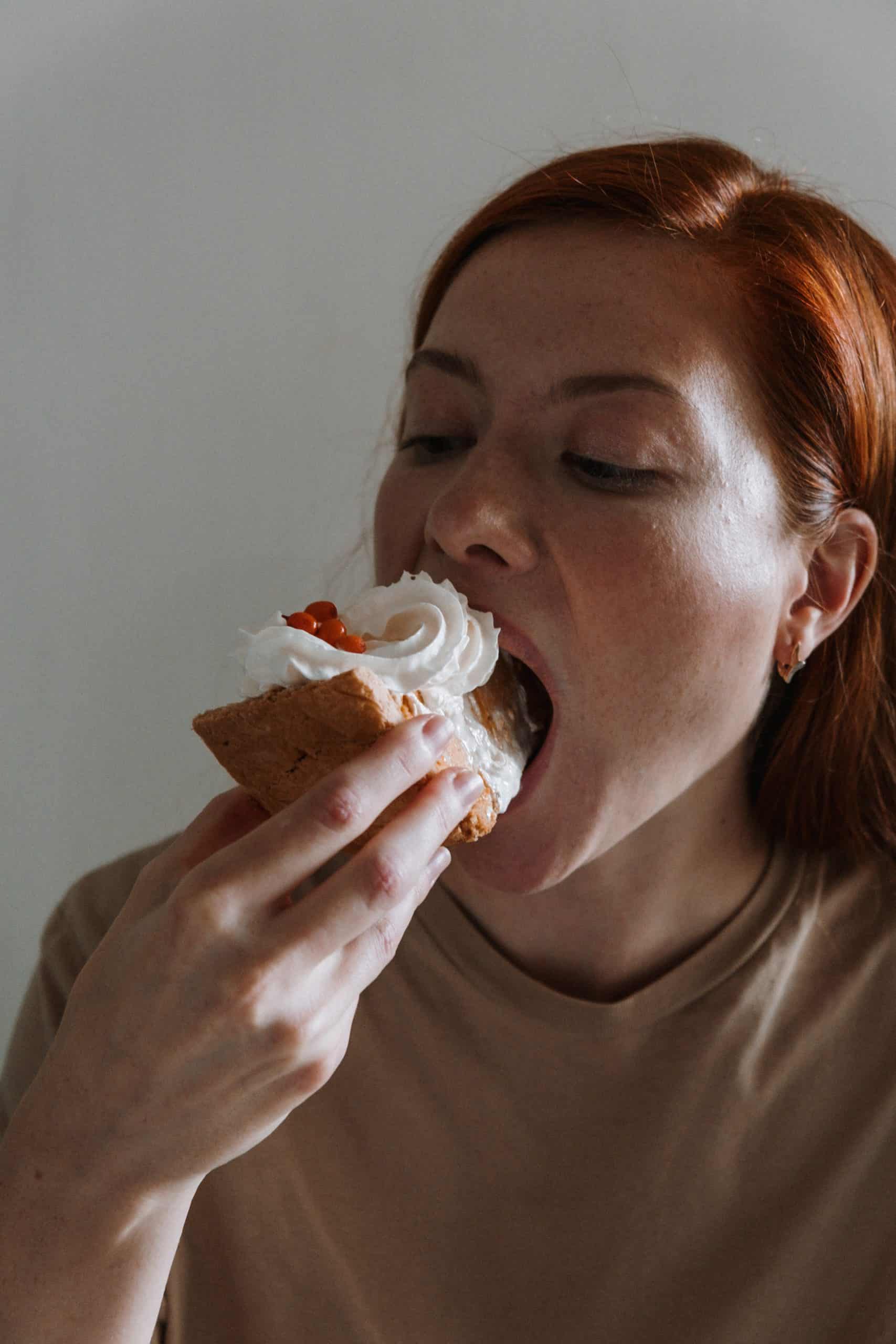 Loving food can be a challenge when trying to lose weight. Here are some tips on how to lose weight when you love food. Picture of a woman eating a large slice of pie.