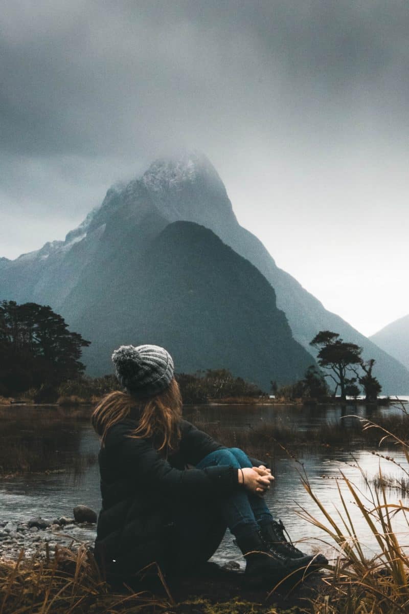 life choices; a woman sitting in front of a mountain