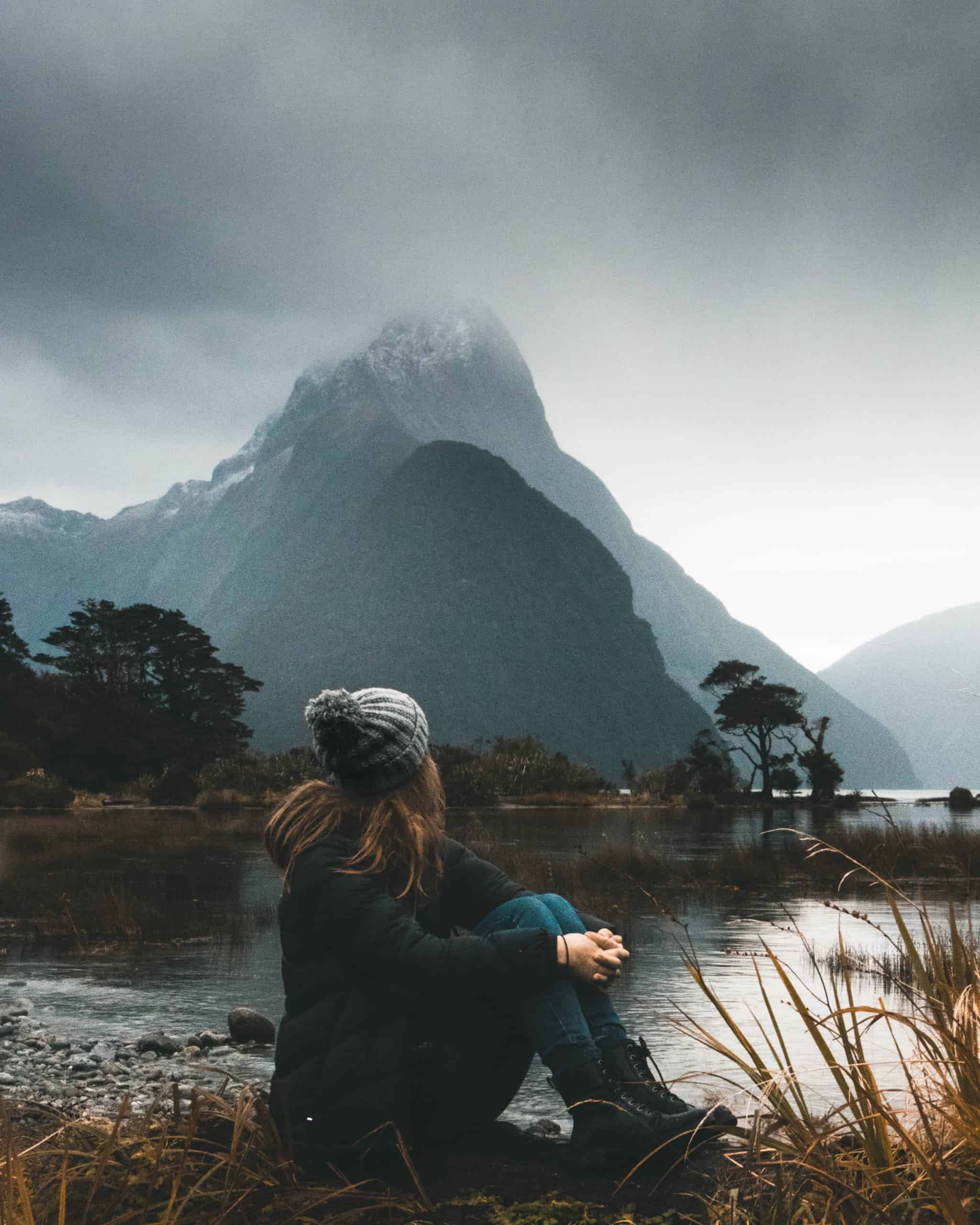 life choices; a woman sitting in front of a mountain