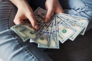 keep your money safe; pictue of a person holding money