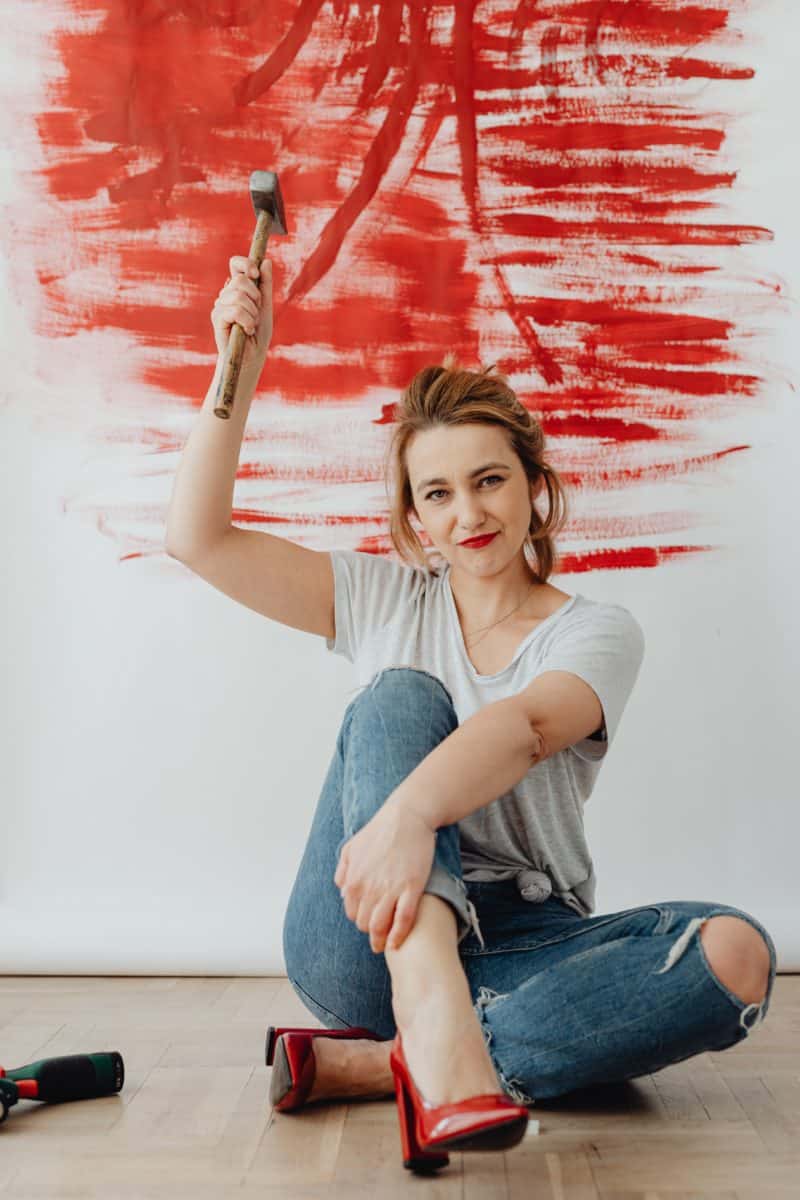 basement remodeling; picture of woman with a hammer