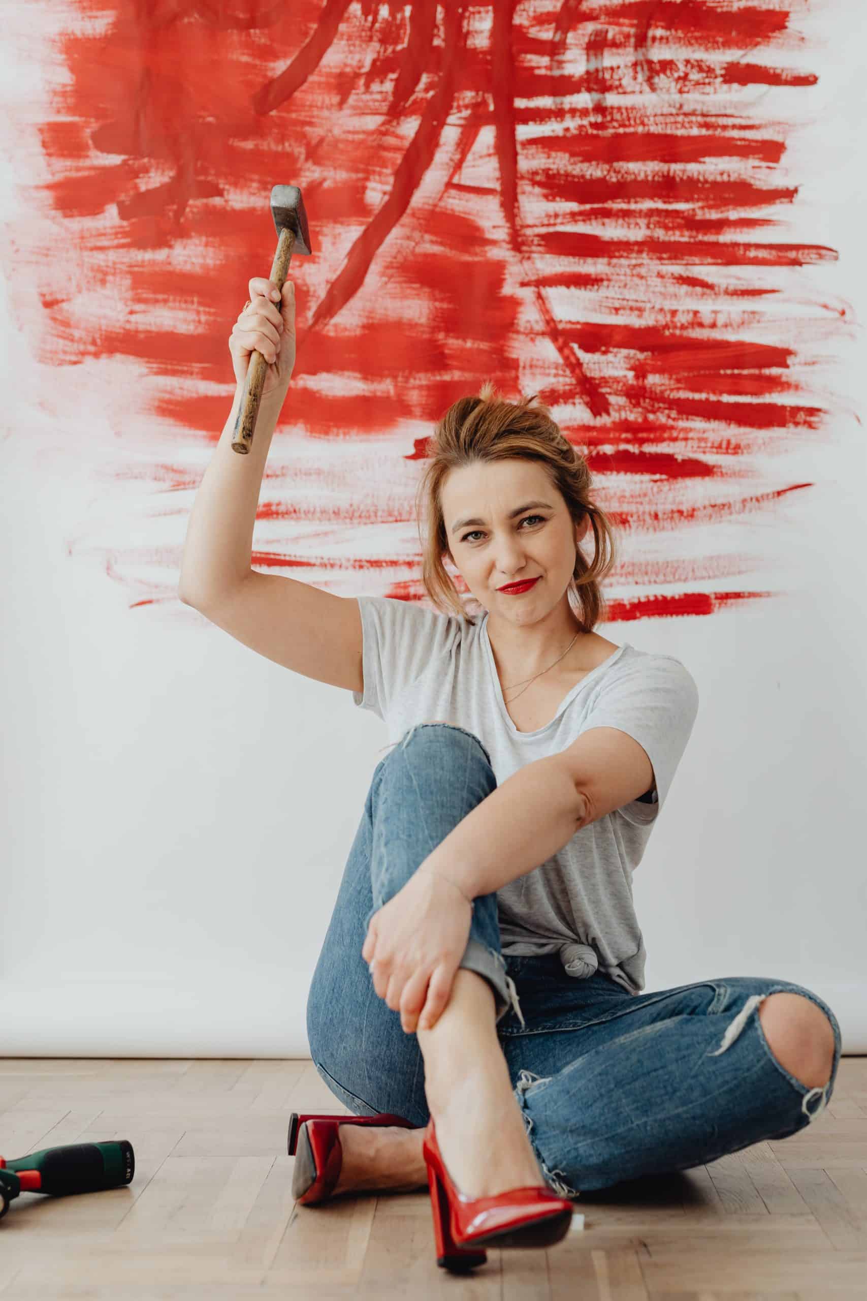 basement remodeling; picture of woman with a hammer