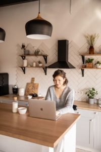Traveler reading online forum comments laptop