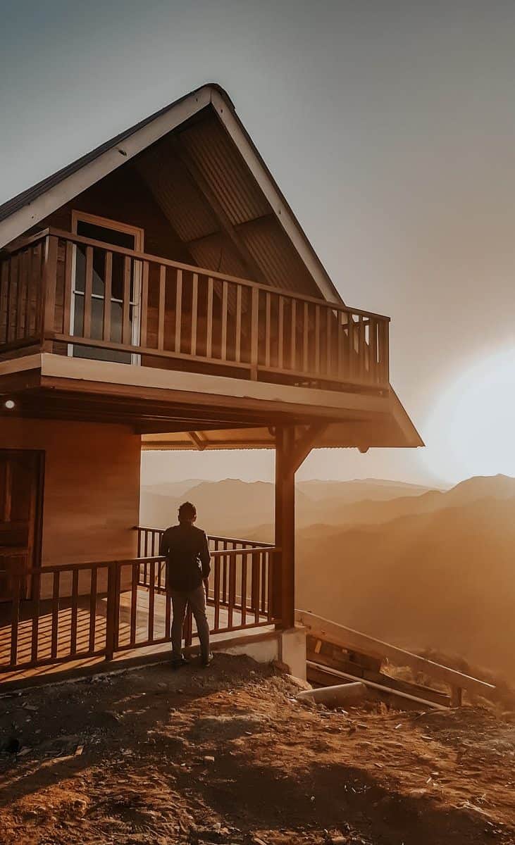 person standing outside the house