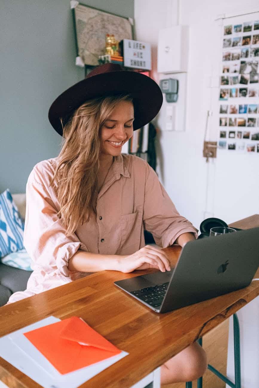 Pursue your passion; smiling woman using laptop