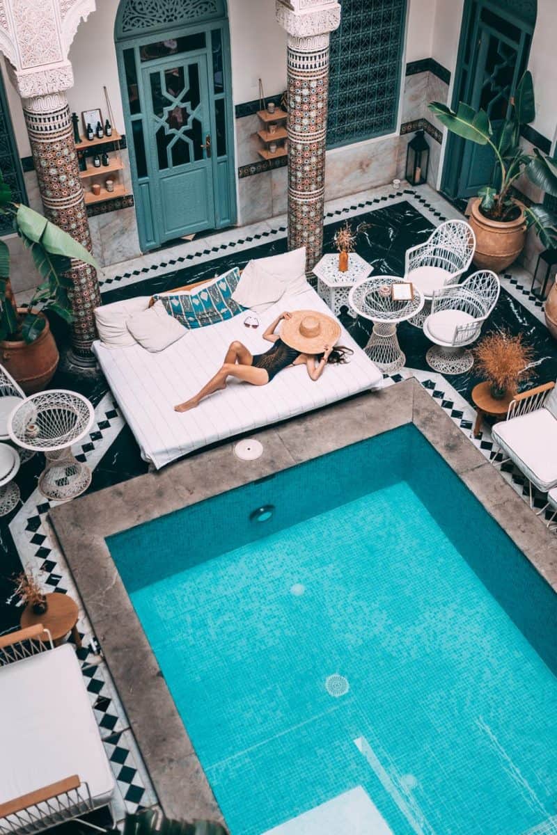 photo of person near swimming pool