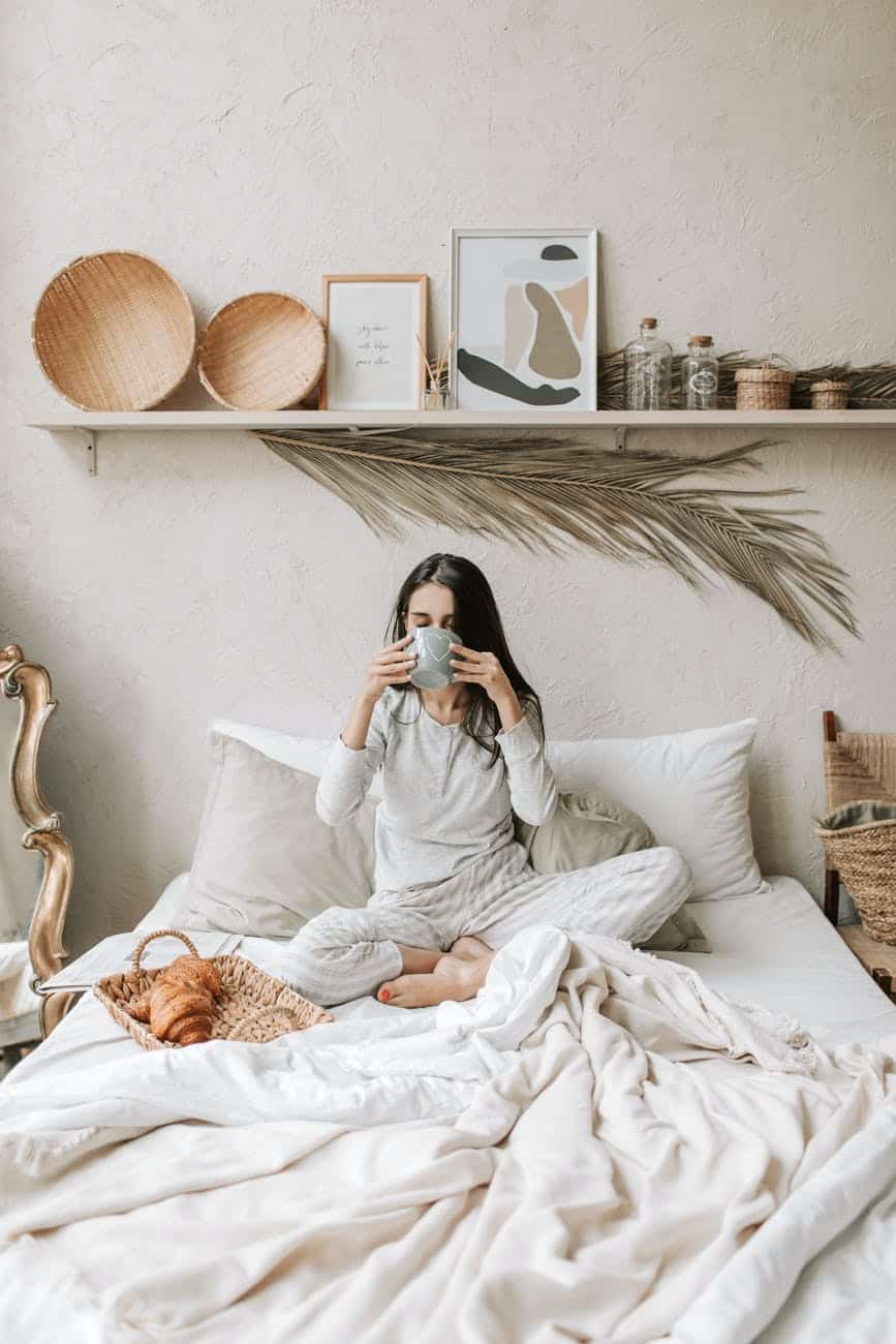 a woman having her breakfast in bed