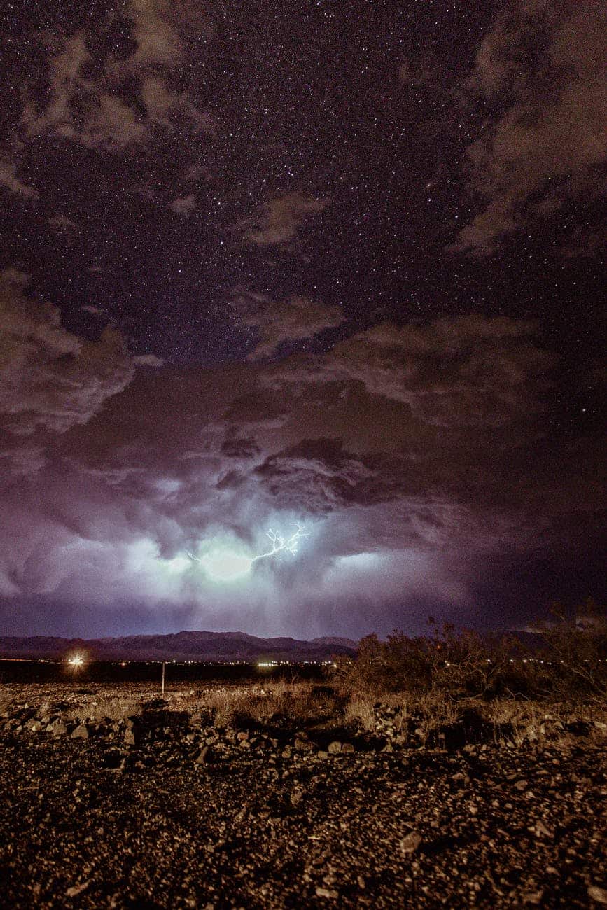 brown field under cloudy sky at night