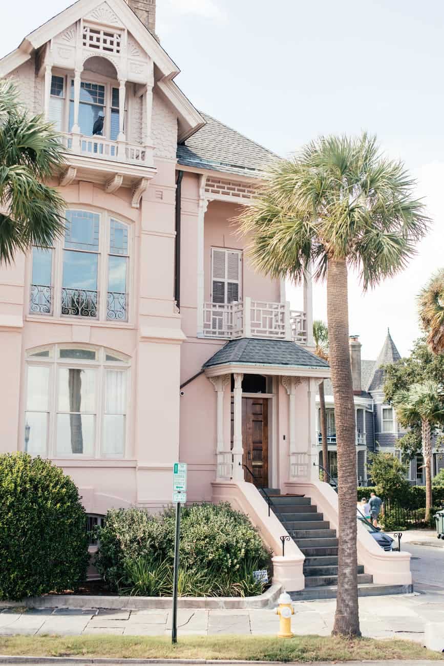 a pink house under the sky