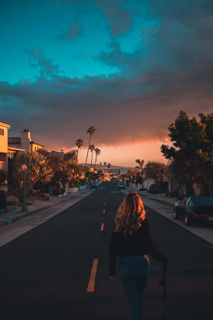 woman walking in the middle of the road