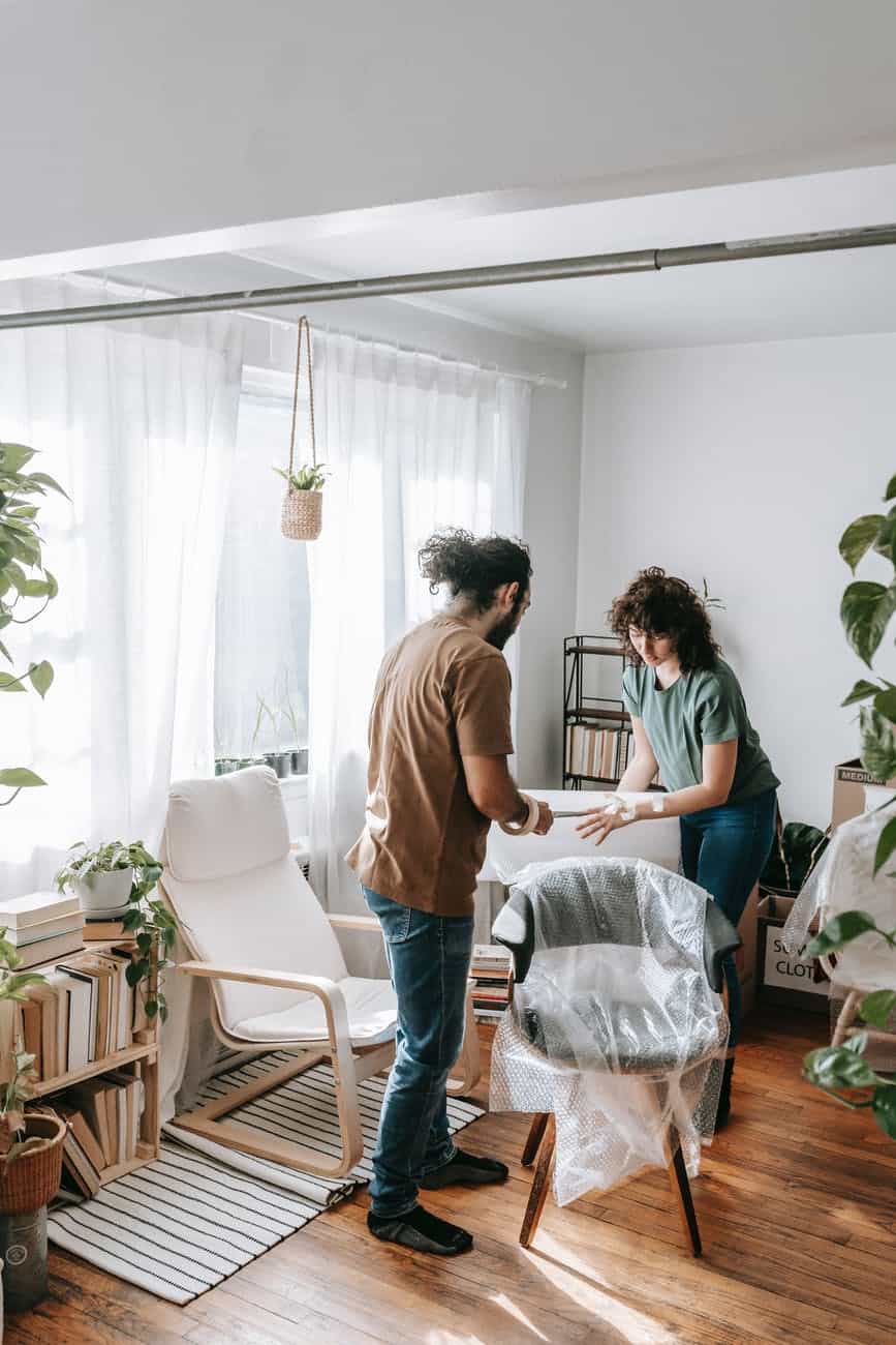 couple wrapping a chair