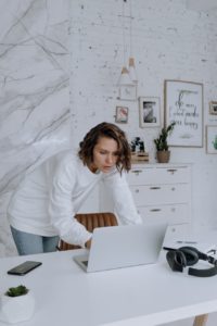 woman in white long sleeve shirt sitting on chair