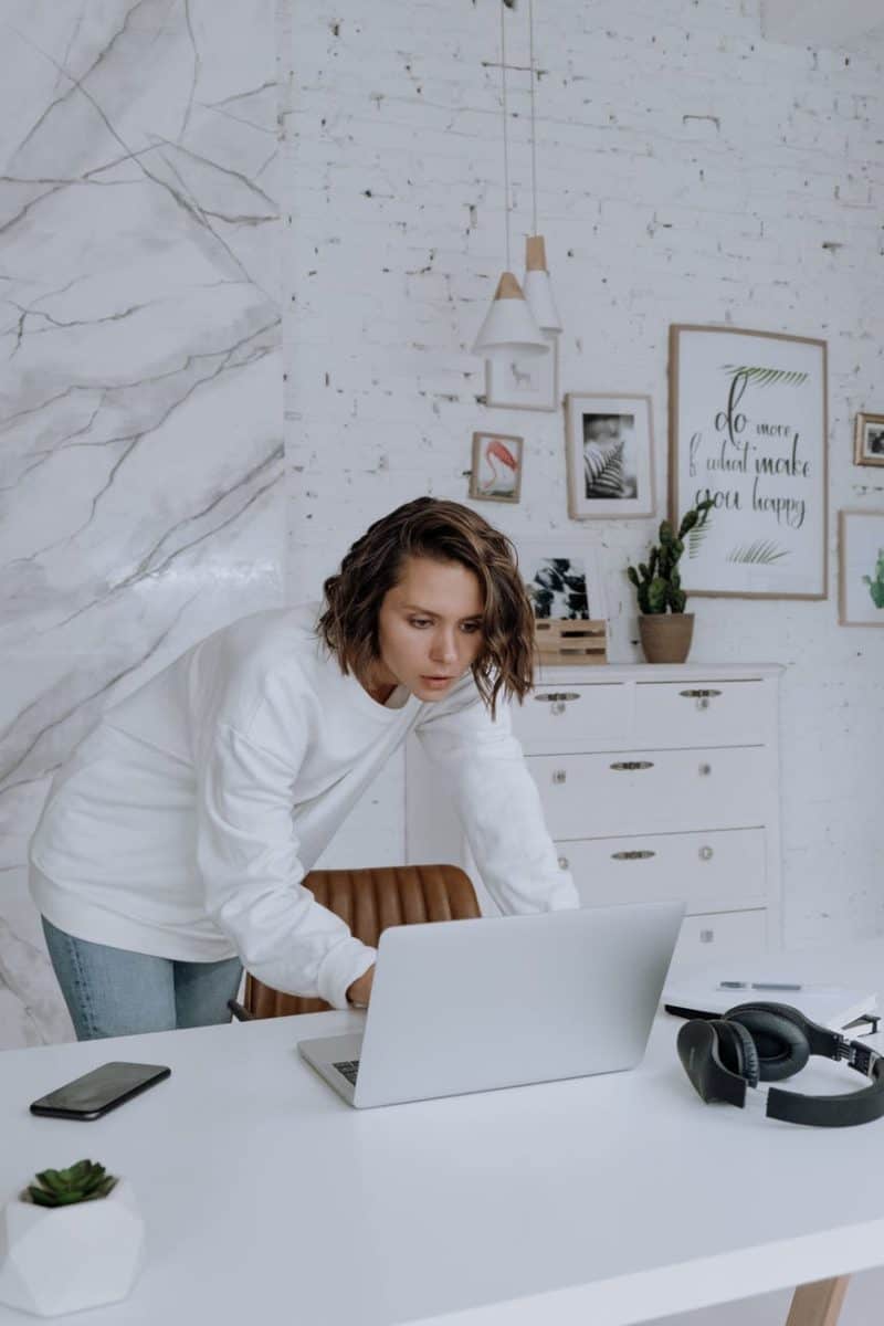 woman in white long sleeve shirt sitting on chair