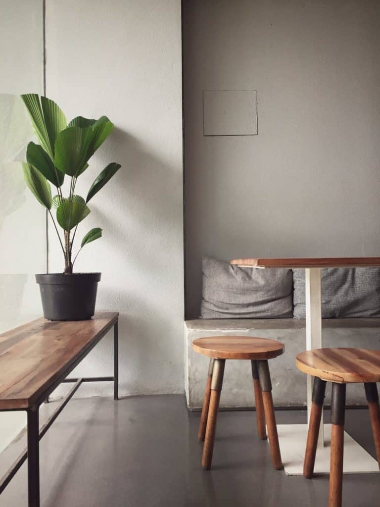 wooden bench and stools in a cozy room; minimalist lifestyle