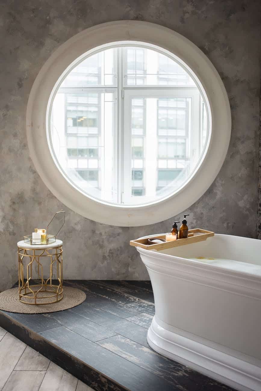 interior of modern bathroom with round window