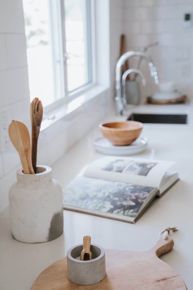 an open book on white kitchen countertop