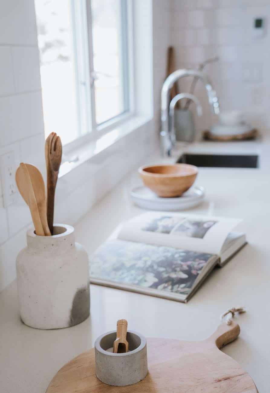 an open book on white kitchen countertop