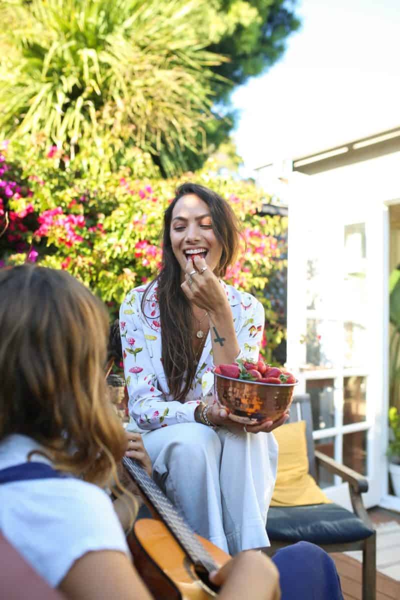 happy woman eating strawberries