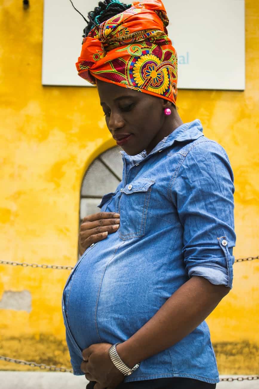 standing woman holding her belly