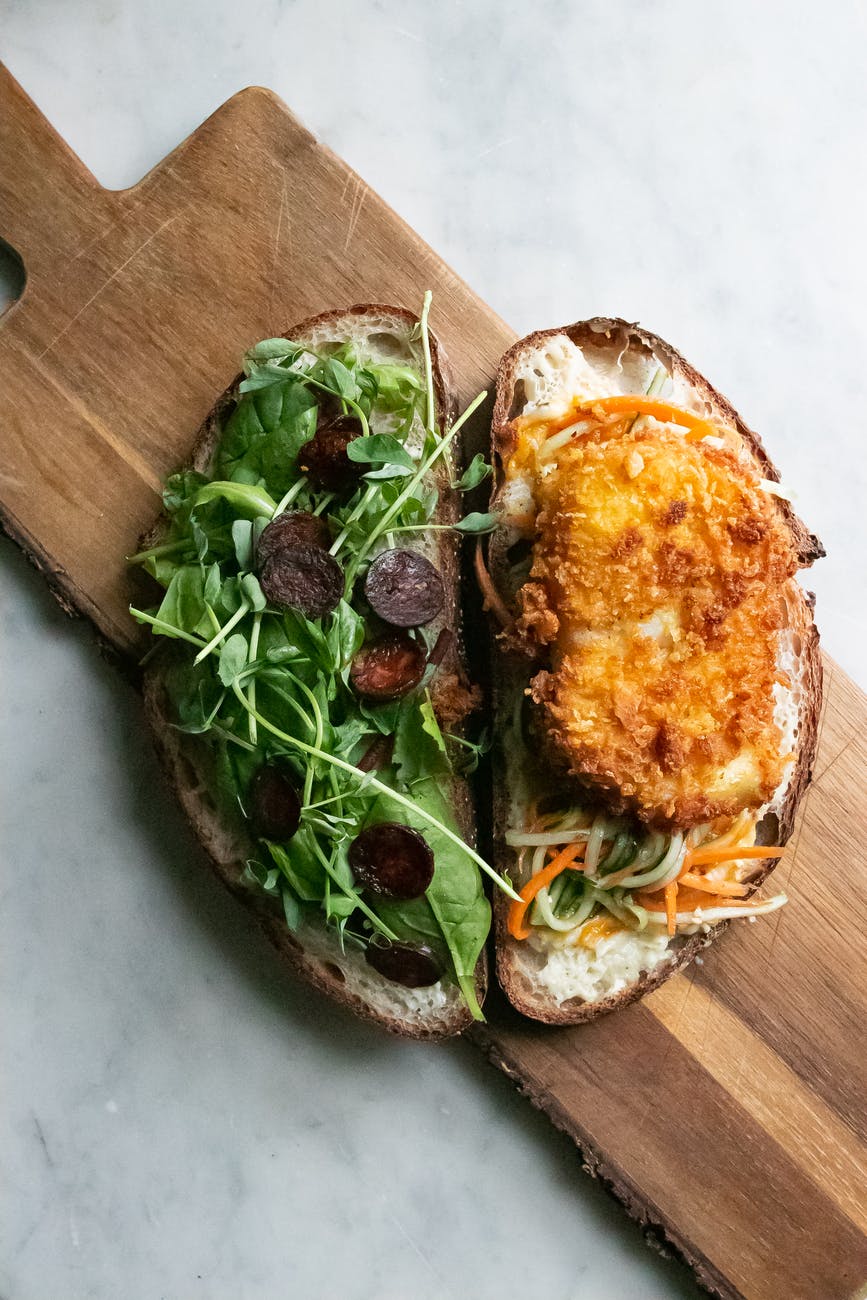 delicious slices of bread with rucola and chicken