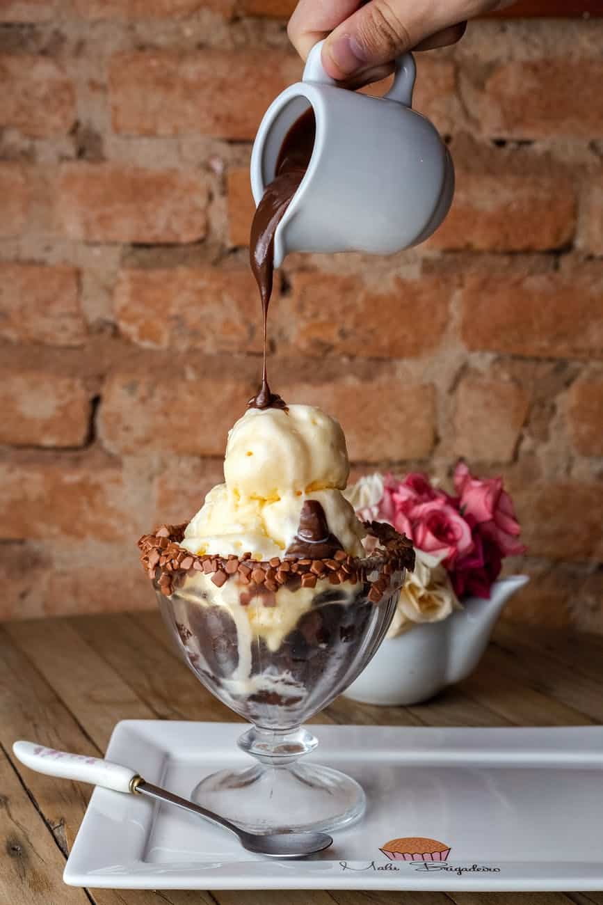 ice cream with chocolate chips topped with melted chocolate