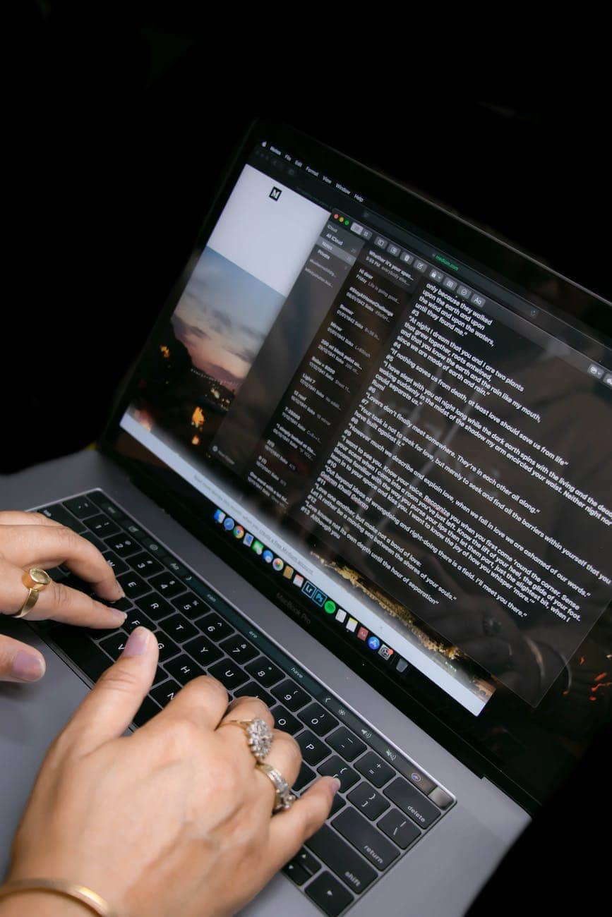 unrecognizable woman using chat while typing on laptop at home