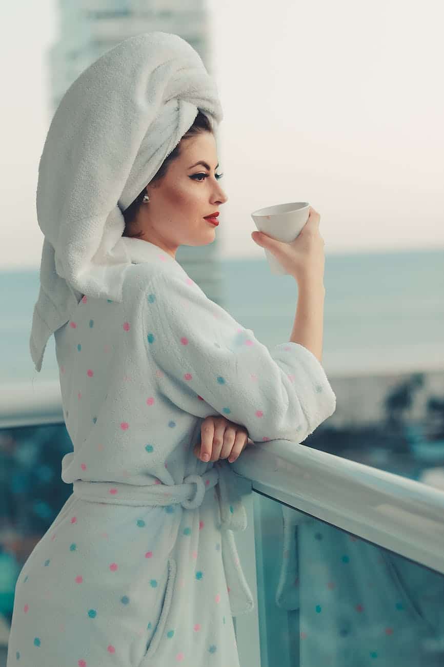 photo of woman wearing bathrobe