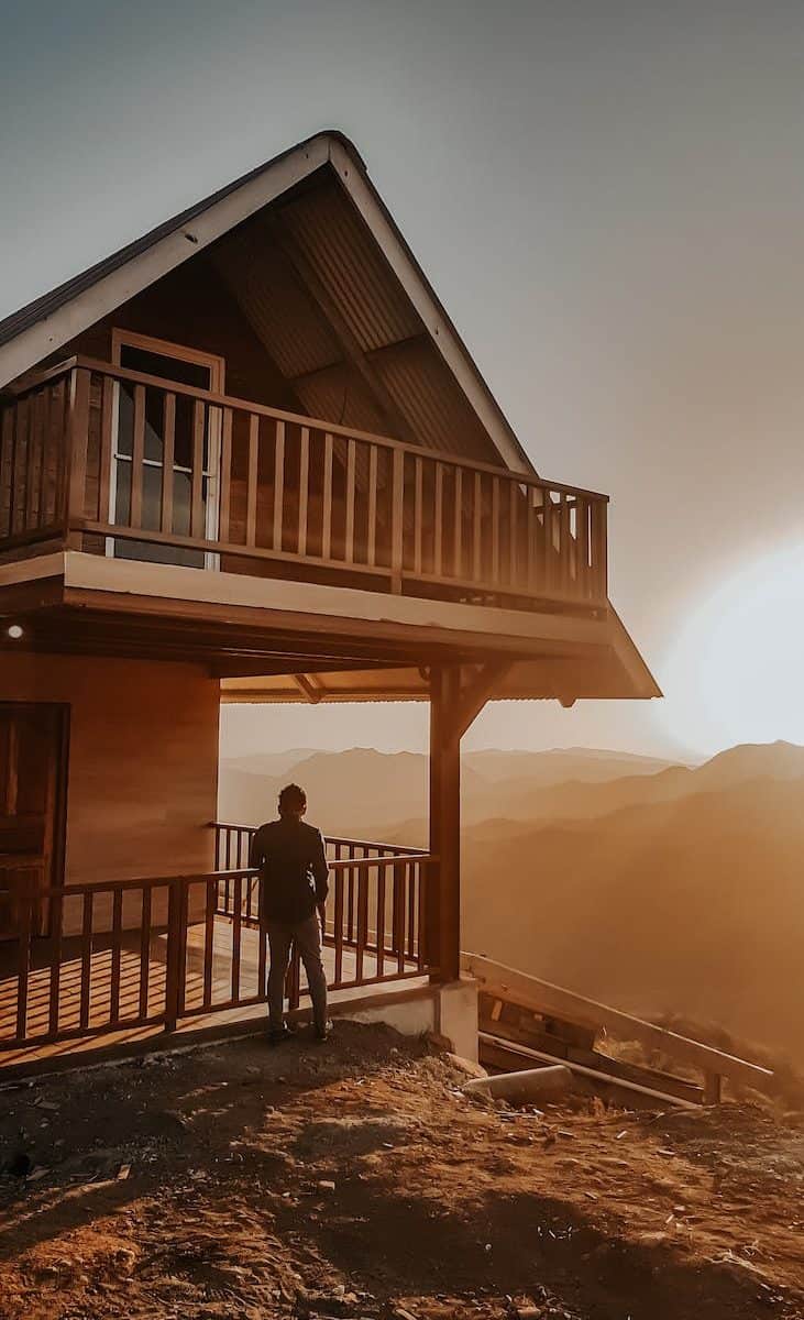 person standing outside the house