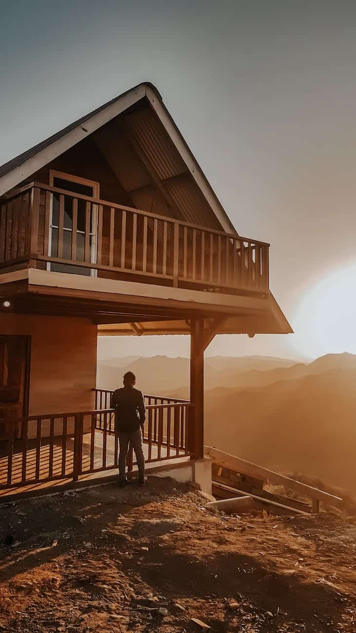 person standing outside the house