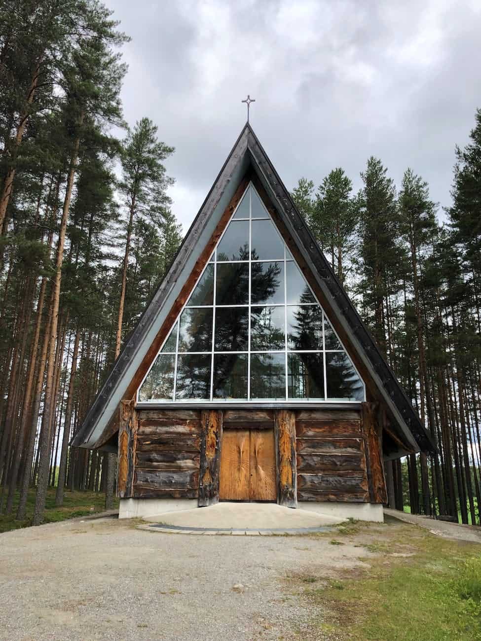 photo of wooden house in the middle of the forest