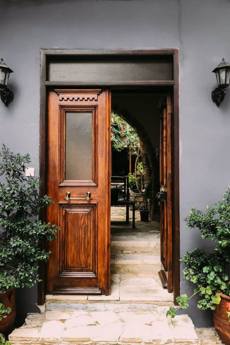 opened brown wooden french door