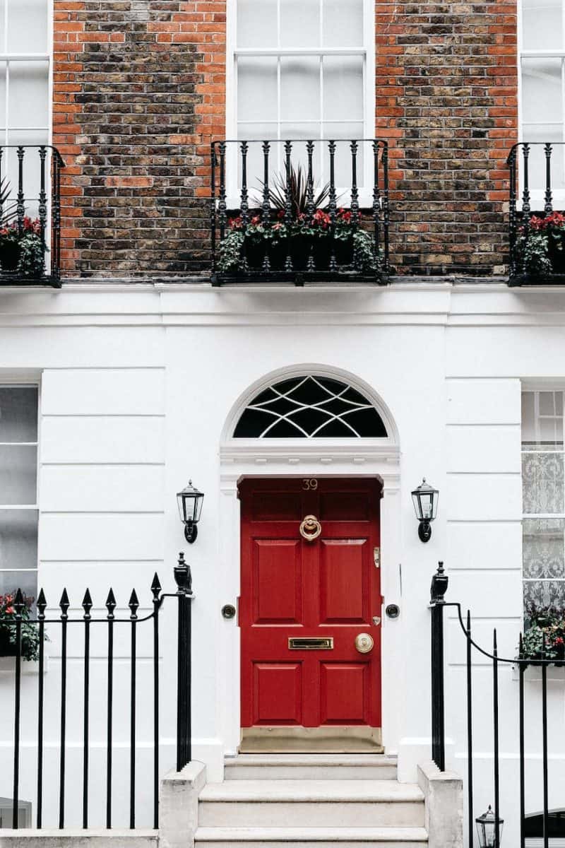 facade of residential building with red door