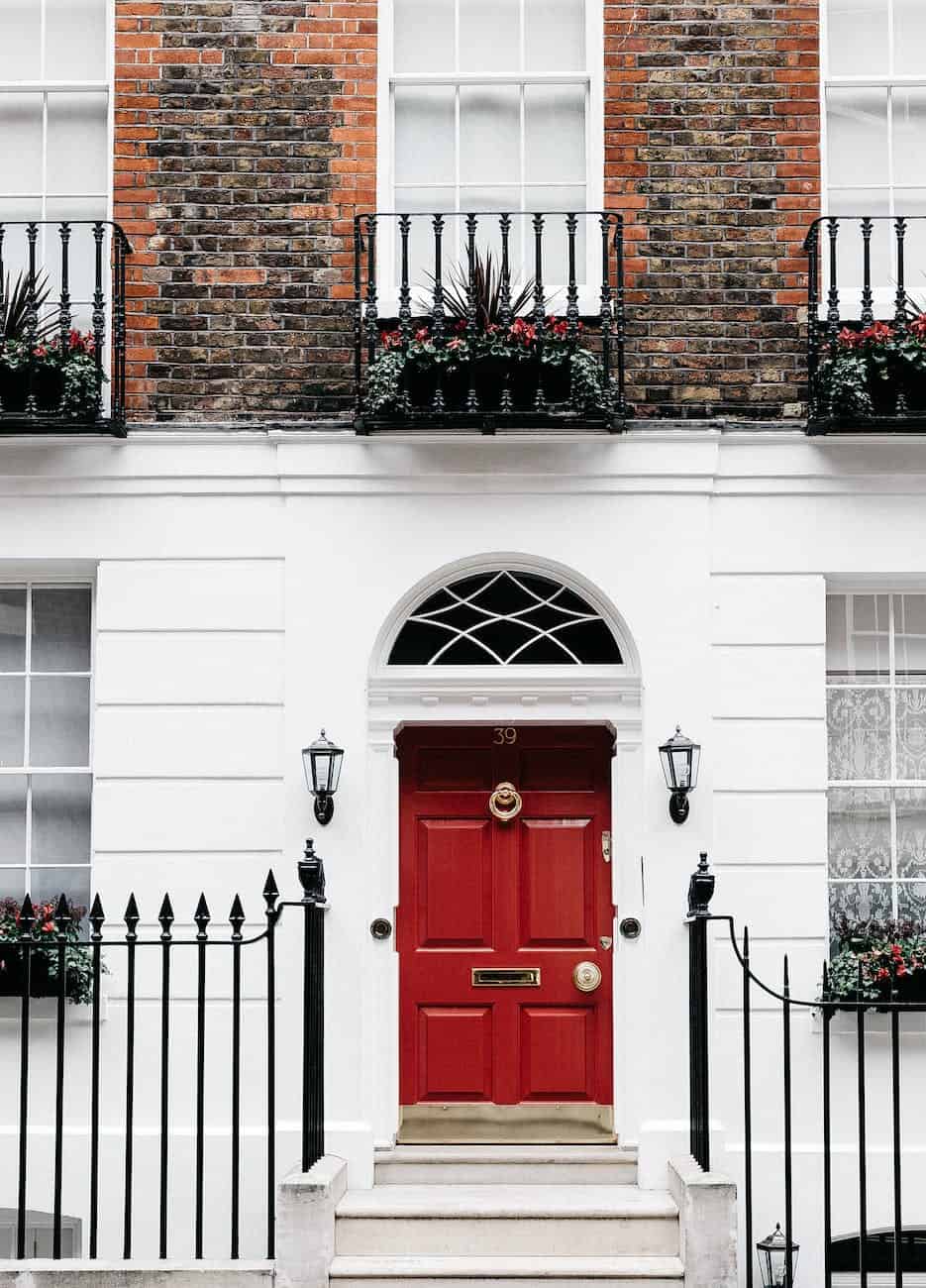 facade of residential building with red door