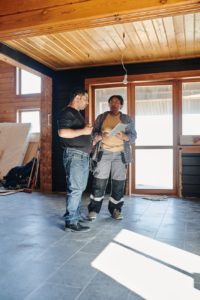 two people checking on a construction project
