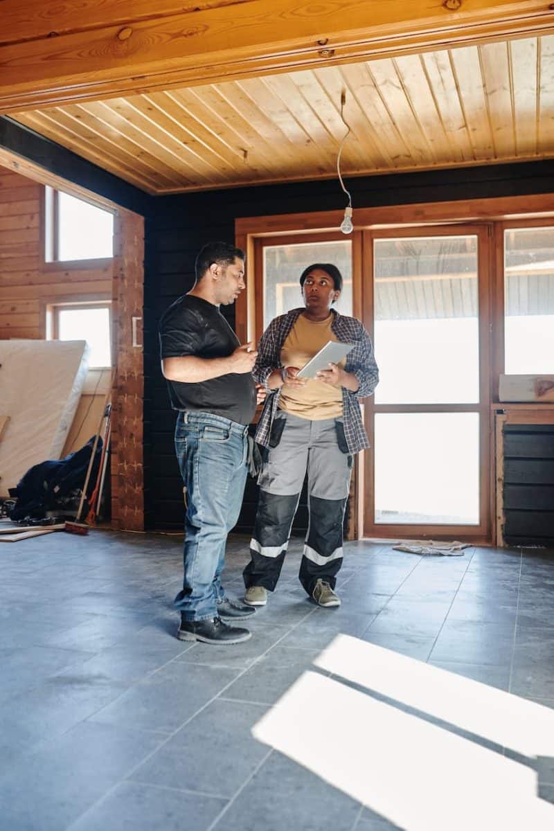 two people checking on a construction project