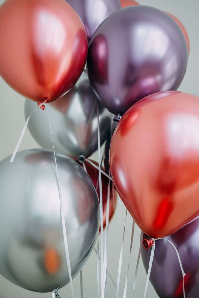 colose up photo of assorted colored balloons