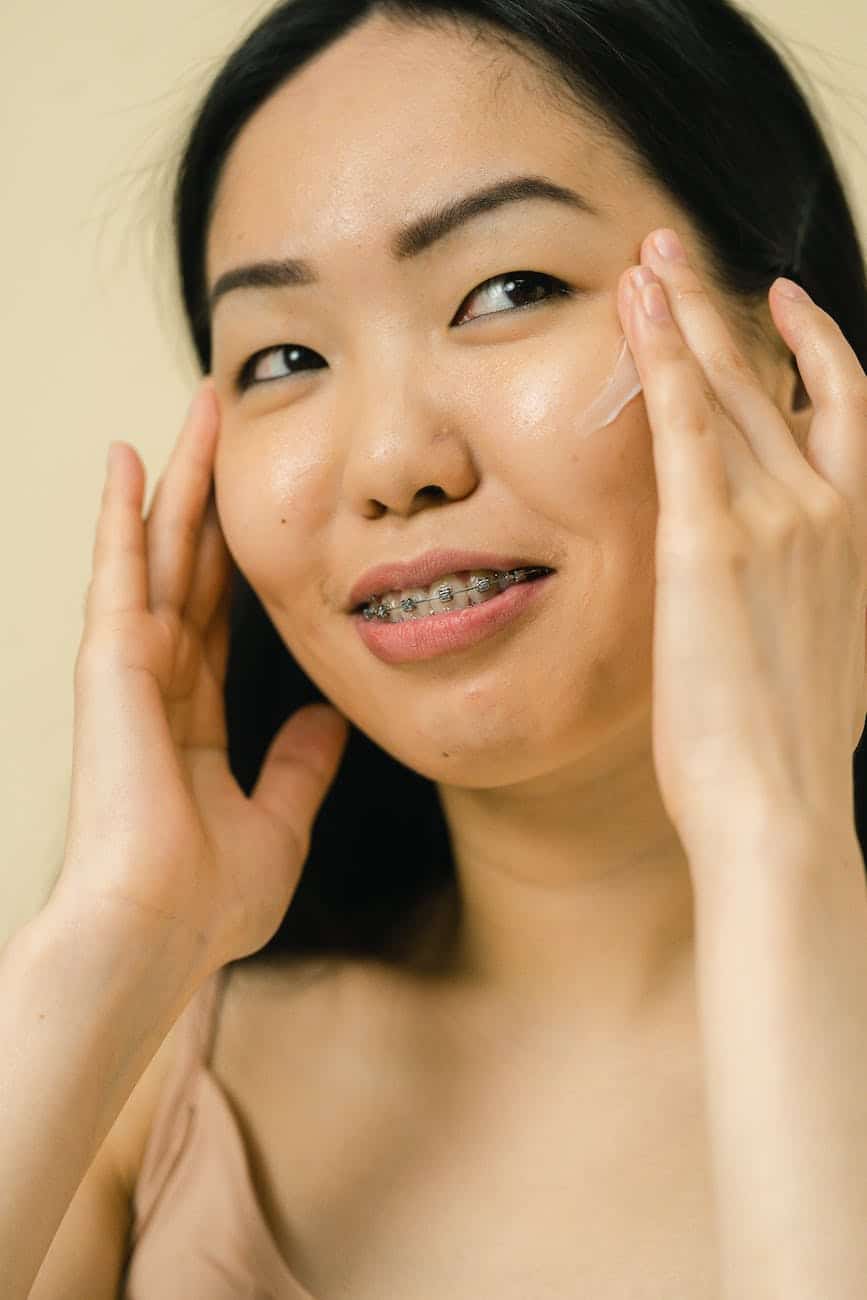 portrait of woman with cream on face