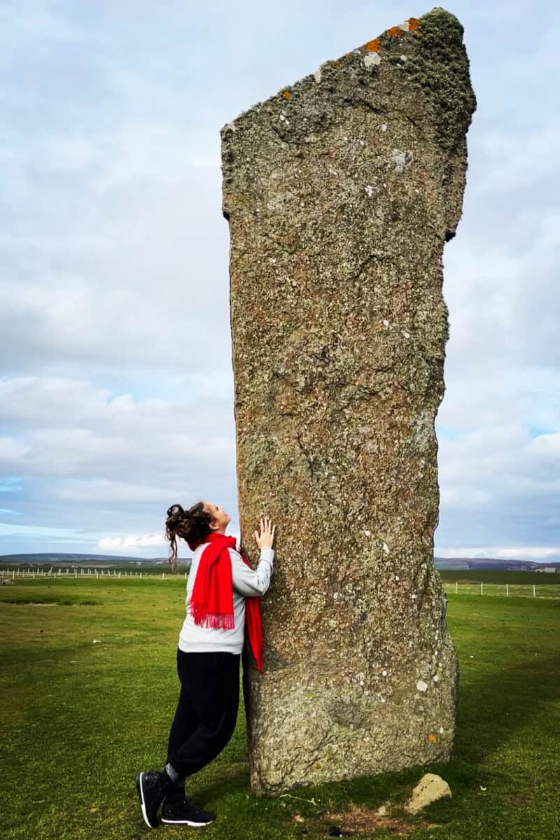 Kathy Haan at a standing stone in Orkney