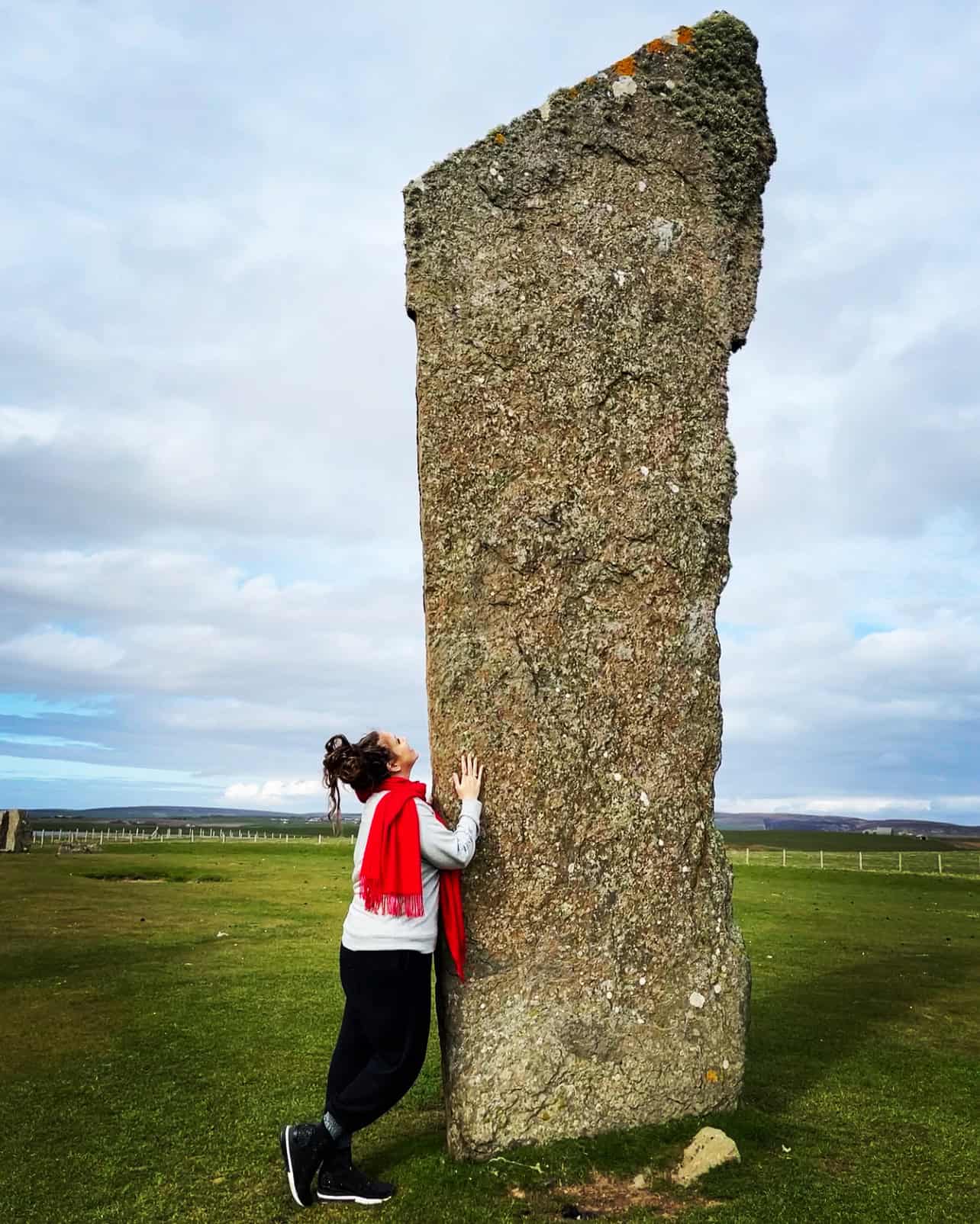 Kathy Haan at a standing stone in Orkney