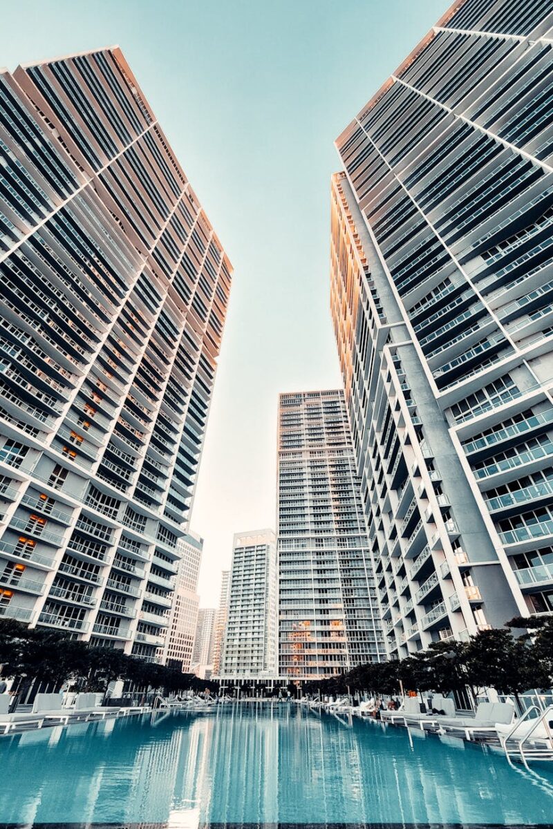 swimming pool near buildings under blue sky