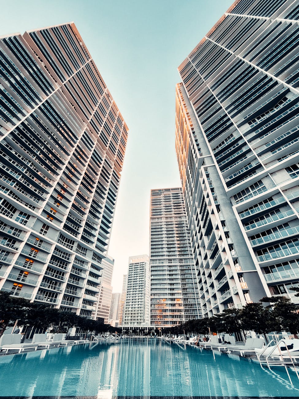 swimming pool near buildings under blue sky